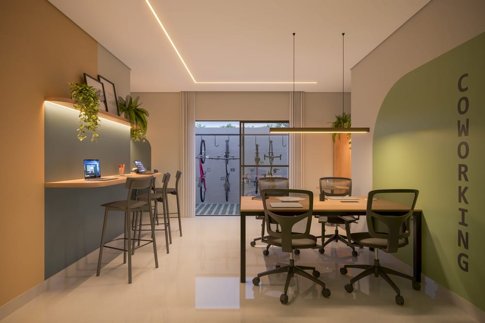 Coworking do Visconti 2150 com bancada alta, mesa de reunião e bicicletário integrado